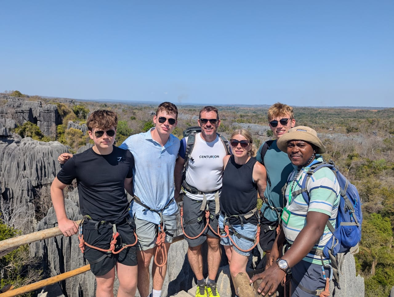 Astani Ringo with a family group at a viewpoint over the Tsingy de Bemaraha