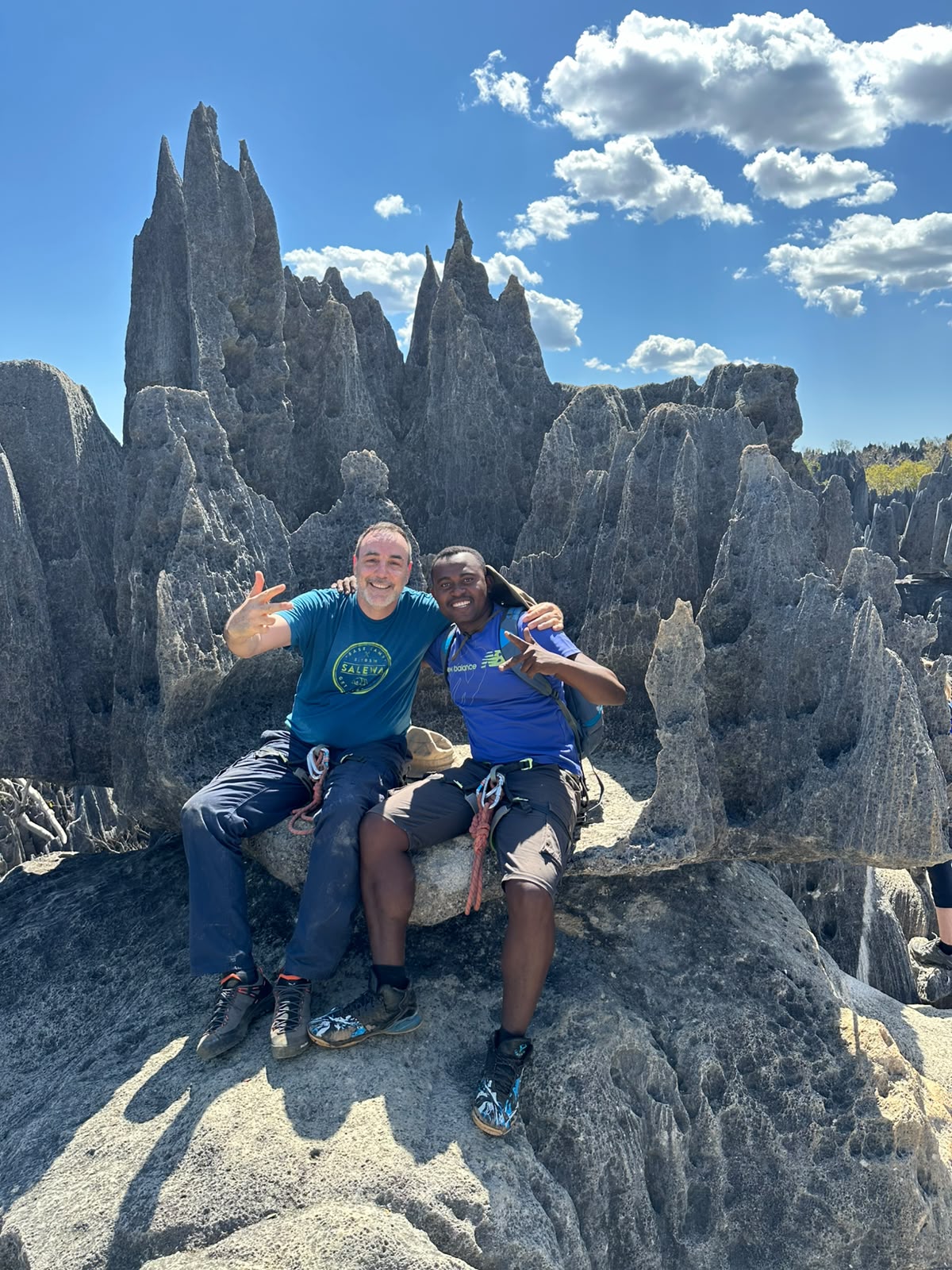 Astani Ringo with a guest sitting on the limestone pinnacles of the Grand Tsingy circuit