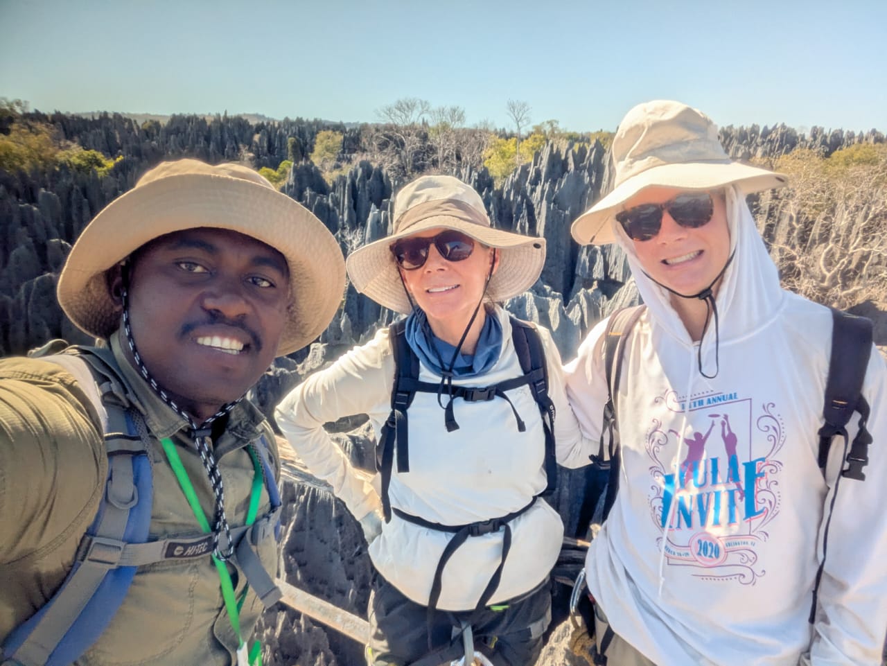 Astani with two travellers on the limestone pinnacles of the Grand Tsingy circuit